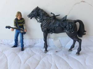lot 126 image: NECA Kurt Cobain action figure and horse figure from Lord of the Rings