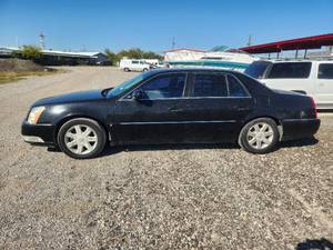 lot 10 image: 2006 Cadillac DTS - runs and drives - Engine light is on - Vin#1G6KD57Y06U101968 - Come and Preview - NO TITLE - Buyer will need to apply for lost or Bonded title. - SOLD AS IS