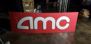 lot 38 image: LARGE Metal AMC Sign (CAN BE BACKLIT), Great for a Home Theater  Measures Approx 7 x 26