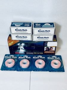 lot 42 image: Lot of 9 - (4) New Beauty Mark Surface Mount Dispensers & (4) Professional Hair Styling Tape & Professional Mini Flat Iron