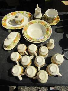 lot 21 image: Vernon Ware Metlox dishes part 2,  oval serving platter, creamer and suger dishes, salt shaker, 11 handled coffee cups, 2 large serving bowls, Round butter dish, covered oblong  butter dish