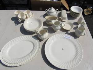 lot 10 image: Johnson Brothers Ironstone dish set, 2 Oval serving platters, creamer and sugar dish, 6 dessert bowls, 5 salad bowls, salt and pepper shaker,  covered butter dish and a gravy boat