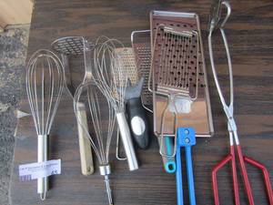 lot 45 image: hand cheese graters , bbq tongs, hand help veggie cutter, potato masher, various metal wisk