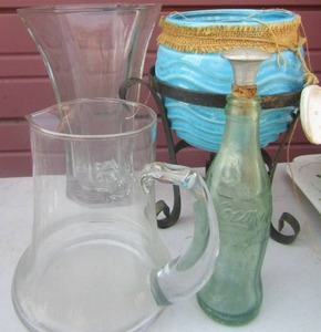 lot 49 image: Blue circle planter on stand, clear glass water piture, clear glass flower vase