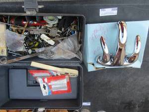 lot 104 image: New bathroom faucet, tool box full of screws, bolts, blades and more