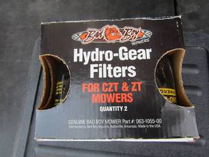 lot 112 image: New pack of Hydro-gear filtersfor C2T-ZT mower, black box contains a few large drill bits,