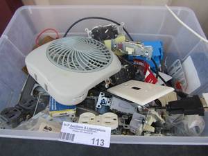 lot 113 image: Small tote of light plugs, wall plugs, sockets, new and used