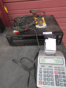 lot 119 image: Sony 5 disc cd changerwith all the cords. Casio electric calculator