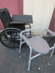 lot 141 image: Black wheel chair like new but used , like new bedside potty chair