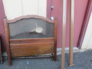 lot 142 image: MCM twin size head  and foot  board with side rails one end is damaged in middle where the wicker is at