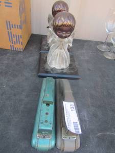 lot 133 image: 2 angel book marks and 2 hand help staplers