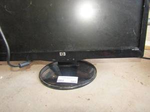 lot 163 image: HP 20 table top flat screen tv with plug, unknown working condition no damage