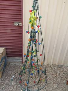 lot 201 image: 55 lite outdoor yard dcor Christmas tree with small tree inside, unknown if it works