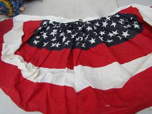 lot 19 image: red milk crate of American flags, and more flag dcor for outside decorations