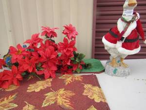 lot 22 image: 16 Christmas goose, lot of red flowers various place matt settings
