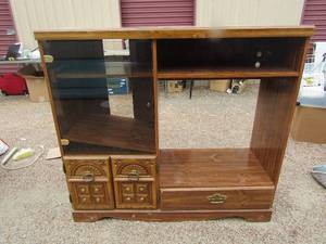 lot 248 image: 444817 tv entertainment center with side and bottom storage, good condition glass front doors