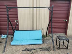 lot 2 image: Outdoor swing with cushions, has one small broken rod easy fix, 1 small sqaure side table comes with