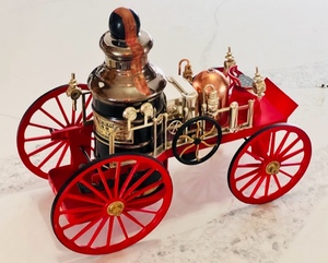 lot 4 image: Vintage Jim Beam Whiskey 1867 Mississippi Fire Engine W Red Wheels &amp Bottle