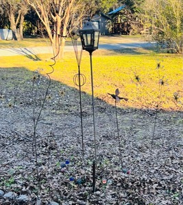 lot 122 image: Seven Piece Set Of Metal Yard Art - Including Night Lamp, Flying Bird And Dragonfly, &amp Multiple Colorful Plants With Stars,Flowers, and Chrystals