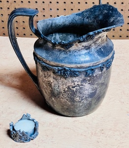 lot 281 image: K. S. Co. Silver Plated on Nickel Pitcher No. C4568 Grapes &amp Grape Vines W Pewter Angel Candle Holder