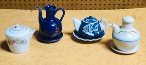 lot 325 image: Four Oriental Mini Tea PotsServers