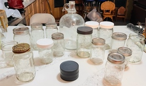 lot 365 image: One Vintage Glass One Gallon Jug & Fifteen Atlas,Ball , and Kerr Mason Jars WThree Additional Lids