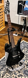 lot 1 image: B. C. Rich Black Mockingbird- Bronze Series -Electric Guitar wStand