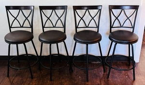 lot 21 image: Four Brown Cushioned Metal Bar StoolsChairs