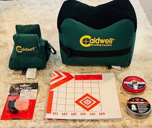 lot 54 image: Caldwell DeadShot Boxed Combo Front &amp Rear Bag, Ear Plugs, Targets, &amp .177 and .22 Pellets