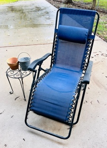 lot 85 image: Comfortable Patio Chair W Metal Planter Table, Galvanized Steel Bucket, and Flower Pot