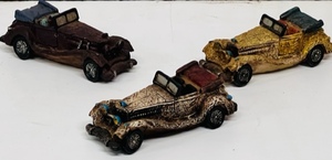 lot 187 image: Three Vintage Hand-Painted Automobile Figurines