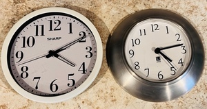 lot 195 image: Sharp &amp Umbra Wall Hanging Clocks