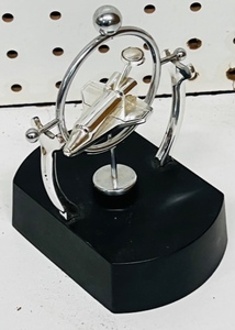 lot 253 image: Magnetic Rocking Space Shuttle Souvenir on Stand