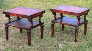 lot 52 image: Pair of Vintage Leonardo Furniture Co. Mahogany 2 Tier End Tables With Red Leather Tops &amp Brass Toe Caps and Casters, and Inlays