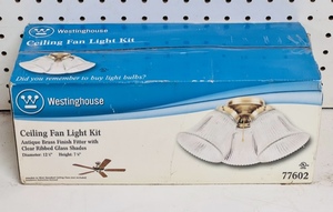 lot 95 image: New Westinghouse Ceiling Fan Light Kit 77602 - Antique Brass Finish Fitter With Clear Ribbed Glass Shades