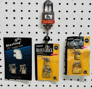 lot 143 image: Four (4) Brass Padlocks, Two (2) Luggage Locks, &amp Public Storage Padlock