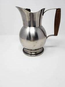 lot 37 image: Oneida 188, Stainless Steel Large Water Pitcher with Wooden Handle, Embossed scrollwork on Base