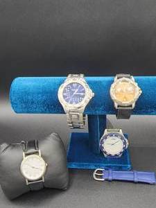 lot 40 image: Lot of Watches as Shown  Magellan Blue Faced Sportswear Watch, Fila Orange Faced 300M-1000ft Water Resistant Quartz and 2 others band needs replaced on one (see pictures)