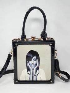 lot 75 image: Purse with Michell Obama Pictured