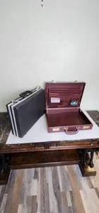 lot 122 image: 2 Brief Cases Both are open, one with Key, the other has no combination