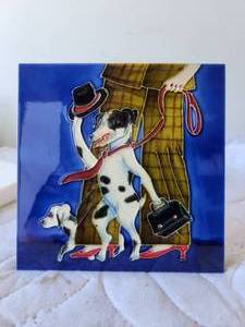 lot 16 image: Decorative ceramic dog tile
