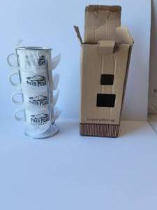 lot 38 image: Boxed set of 4 Pikes Peak coffee cups