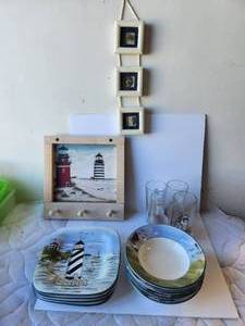 lot 91 image: Lighthouse themed bowls and plates, glasses and more