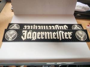 lot 178 image: Jgermeister rubber bardrink mat - 3.5 by 21 - Qty of 2