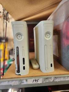 lot 195 image: Selection of 2 Xbox and a remote - untested, no cords