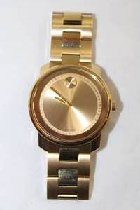 lot 65 image: Movado BOLD Watch. Model MB 01.1.34. 6136 Swiss made. Two tone polished and matte gold flex band and polished gold face.