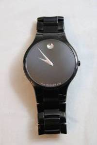 lot 69 image: Movado watch. Model  20.1.36.1197 Swiss made. Sapphire crystal. Black two tone polished and matte flex band.