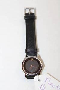 lot 84 image: Movado sleek black watch with leather band. Model 07.3.14.1143 Swiss made.