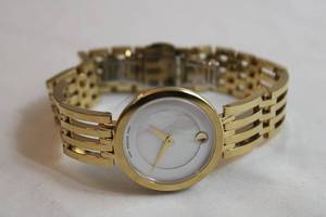 lot 86 image: Movado watch w polished negative space link band. Swiss made. Model 04.8.36.1366 Pearlized face.