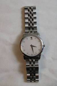 lot 88 image: Movado watch w polished and matte silver link band. Swiss made. Model 07.3.14.1143 Pearlized face.